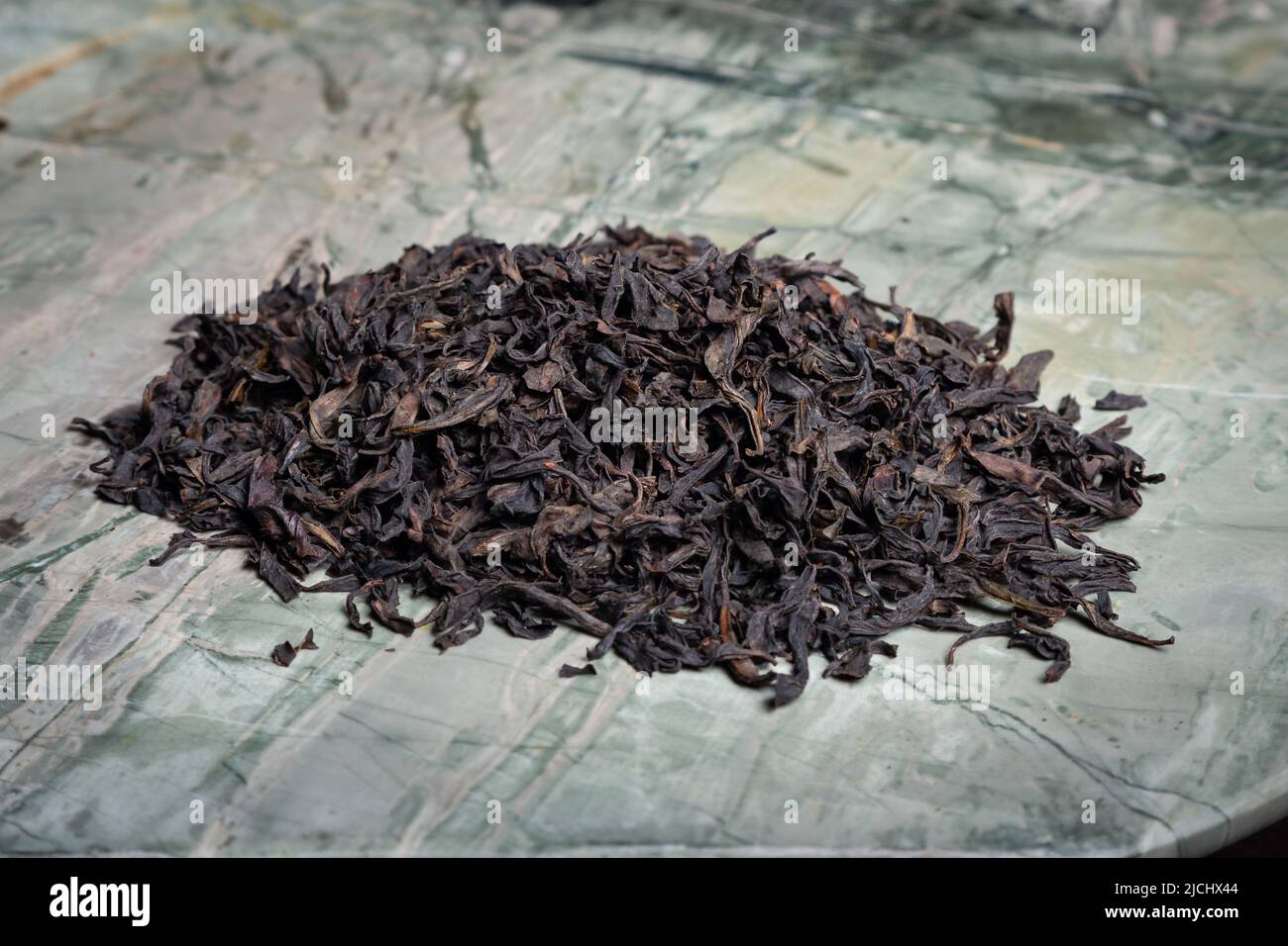 Pu-erh fermented Chinese tea in a roll Stock Photo - Alamy