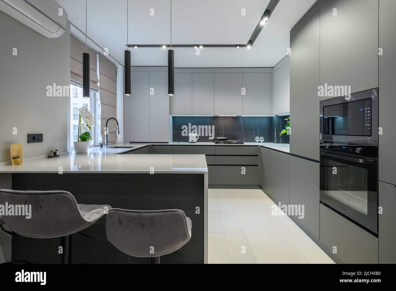 Luxury dining room and kitchen in studio apartment Stock Photo - Alamy
