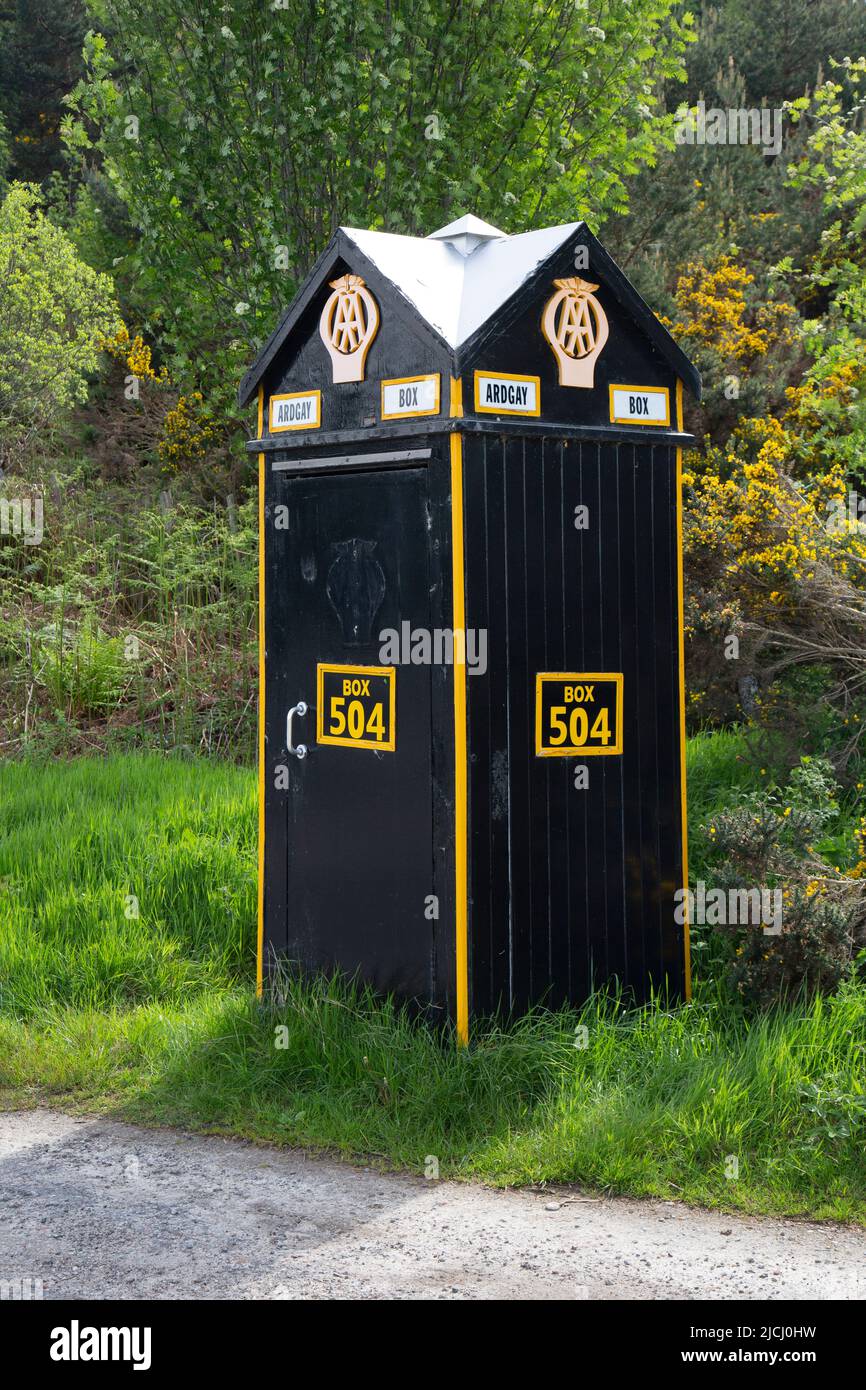 An old AA, Automobile Association, phone box, number 504. Located on in Scotland on the A9 between Tain and Ardgay. Stock Photo