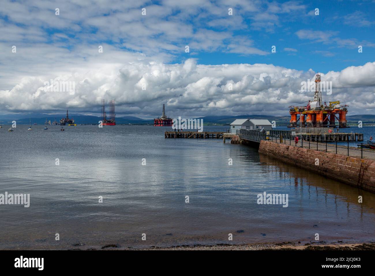 Stored Oil Rigs in Cromarty Firth in the North Coast of Scotland. Rigs are services and stored in the large Firth. Stock Photo