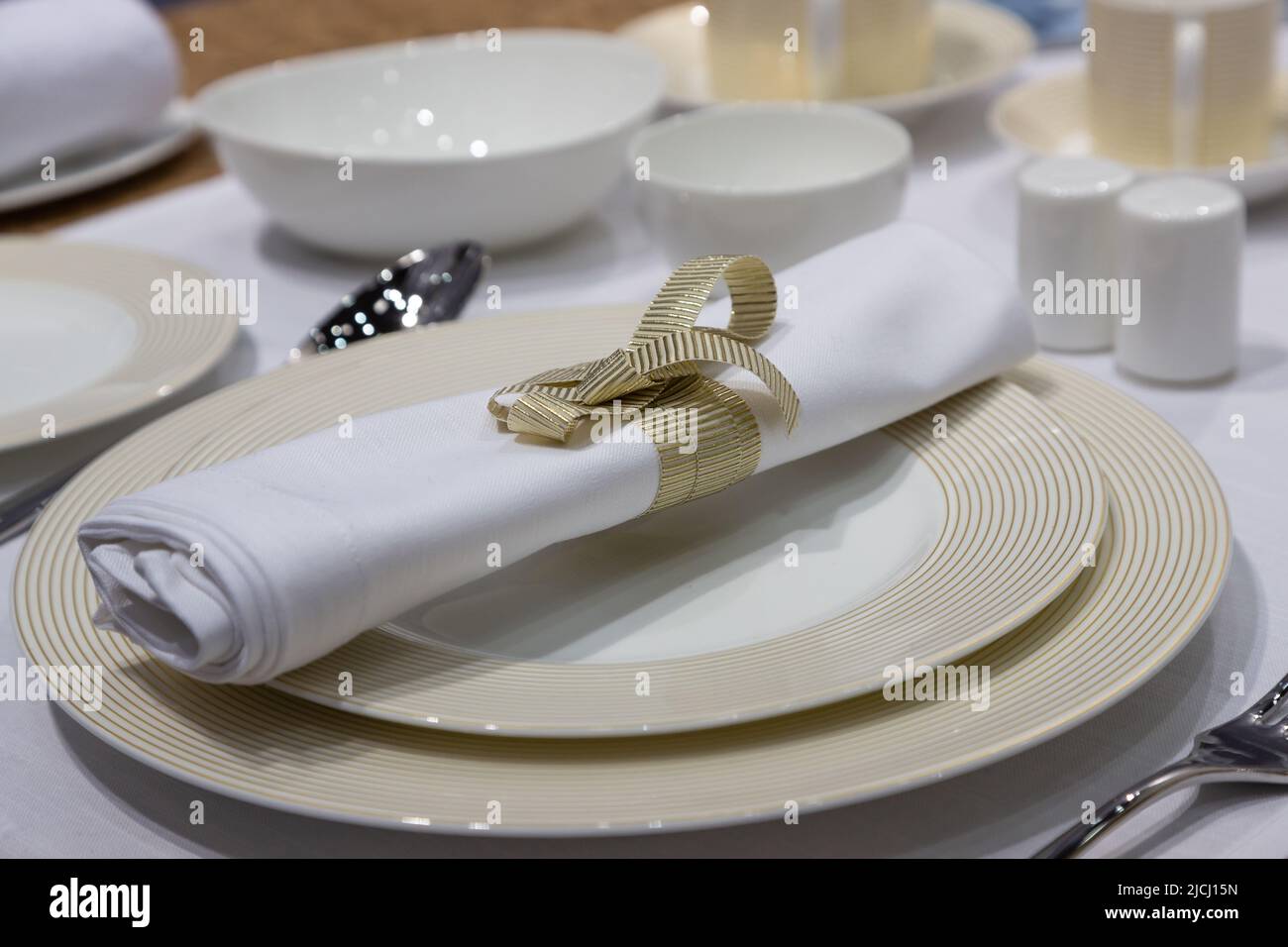 table setting with crockery and napkin Stock Photo