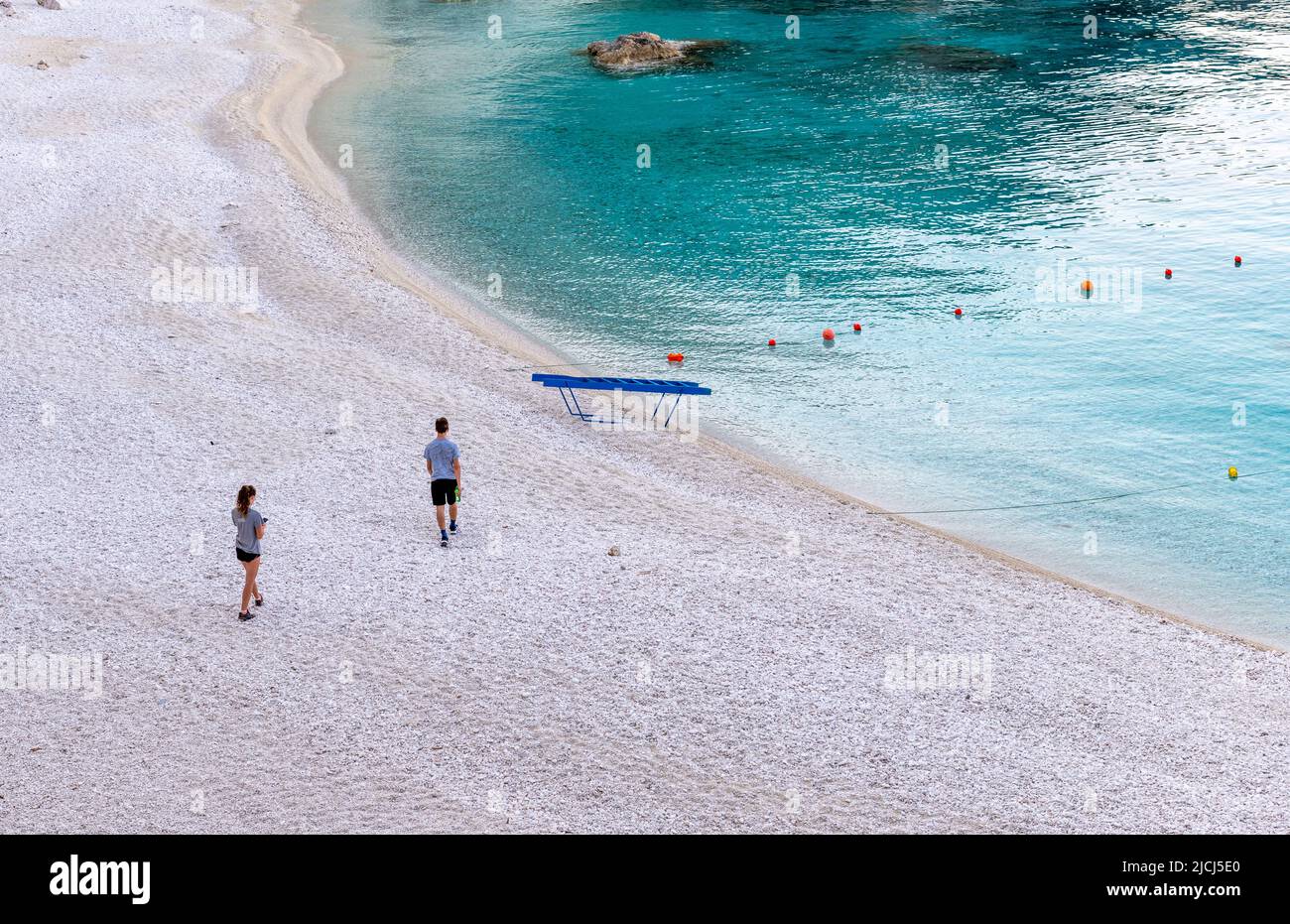 Lefkada Island, Greece-06.05.2022. Young tourists visiting Agiofili Beach early morning before it get crowded. Stock Photo