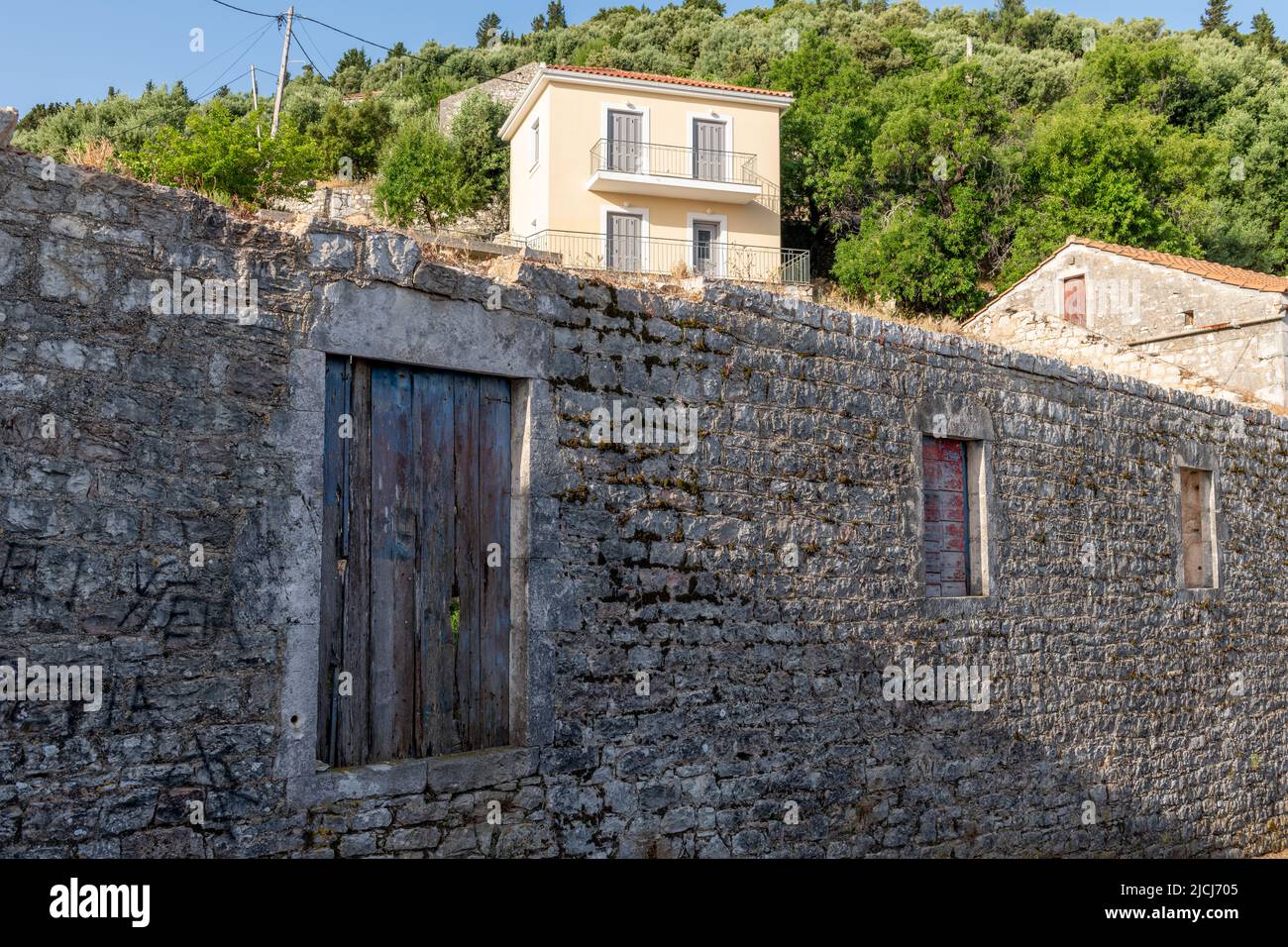 Ithaca Island, Greece-05.25.2022. Buildings on the hillside of Kioni village. A quiet, sleepy holiday destination. Stock Photo