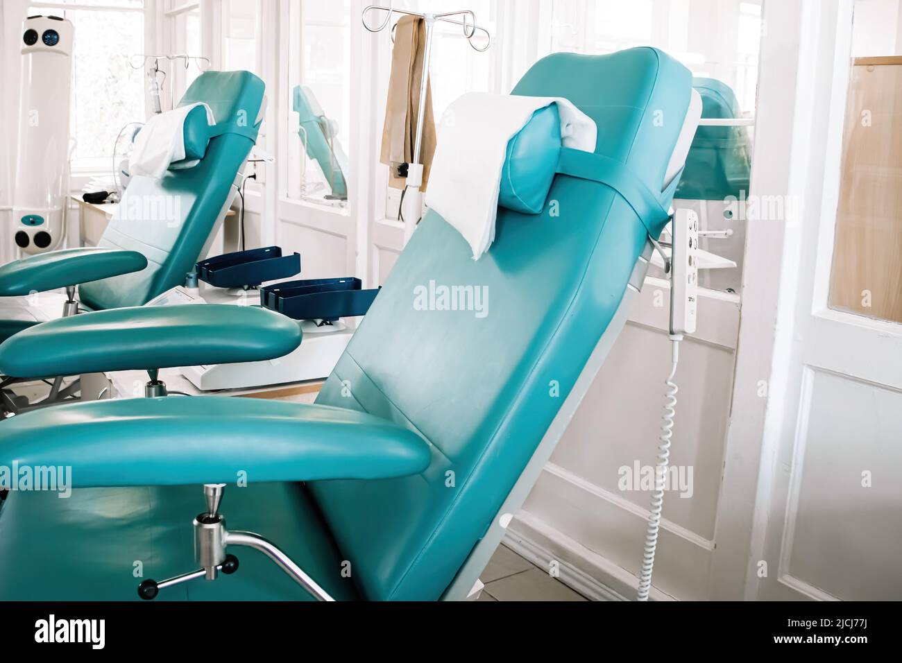 Blood donor chair in medical laboratory. International Blood Donation Day. Equipment for blood transfusion in city blood bank. Stock Photo