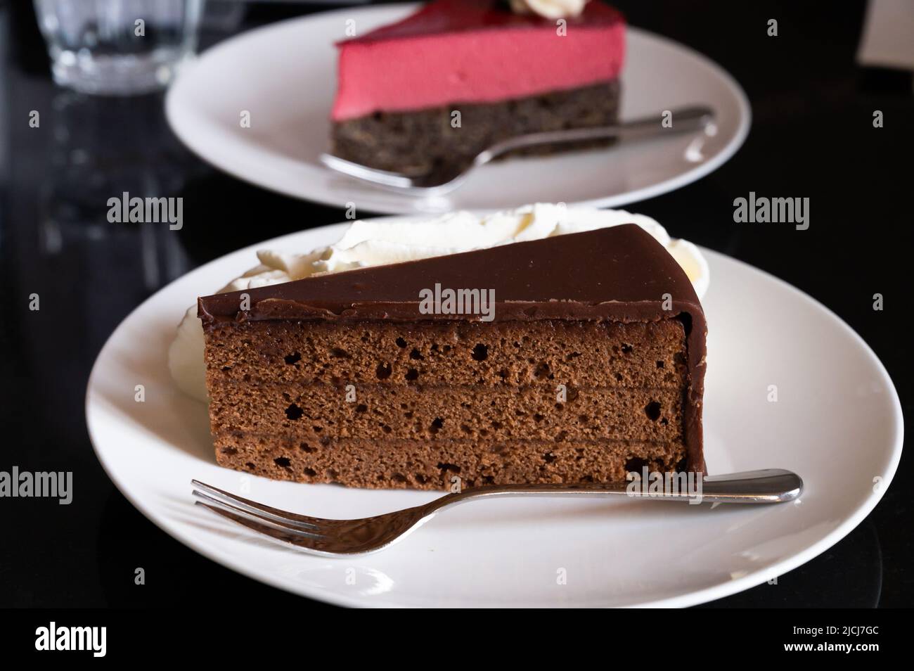Piece of famous Sachertorte chocolate cake with apricot jam and Poppy ...