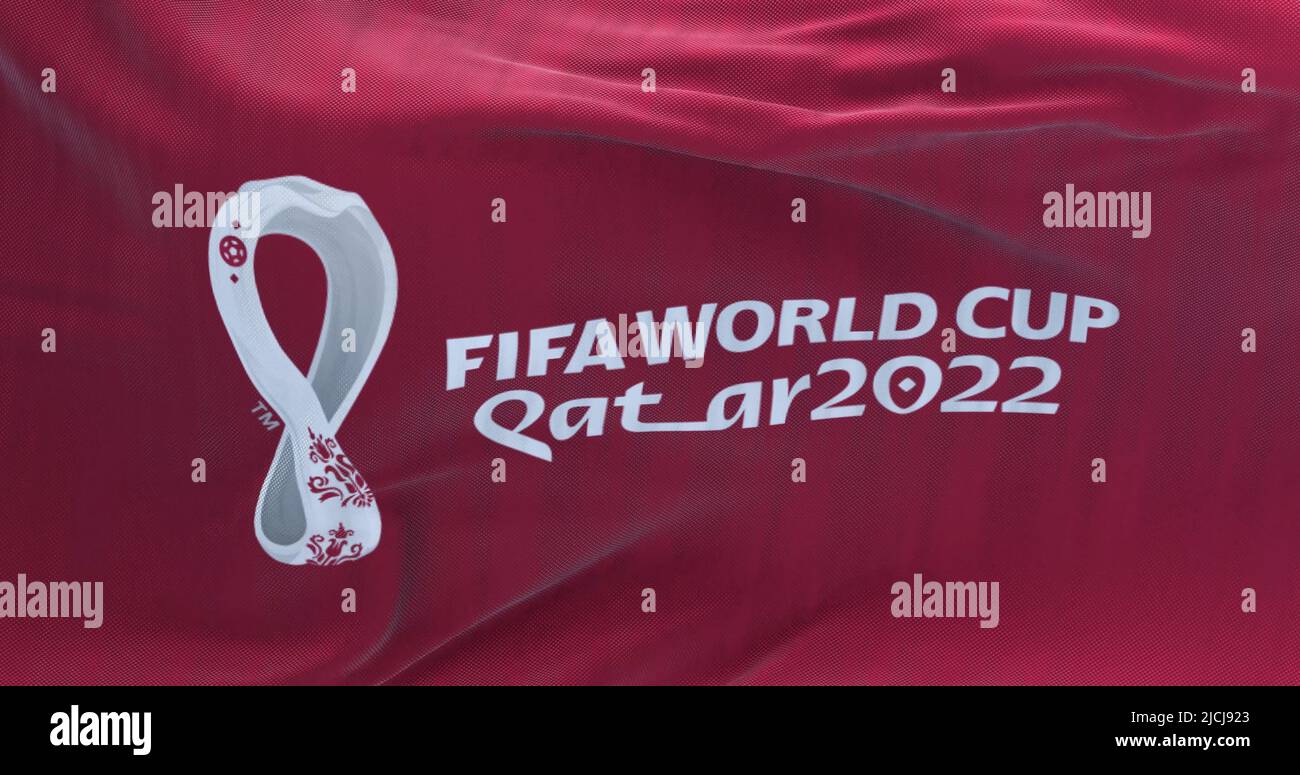 Doha, Qatar, October 2021: Flag with the 2022 Fifa World Cup logo flapping in the wind. The event is scheduled in Qatar from 21 November to 18 Decembe Stock Photo