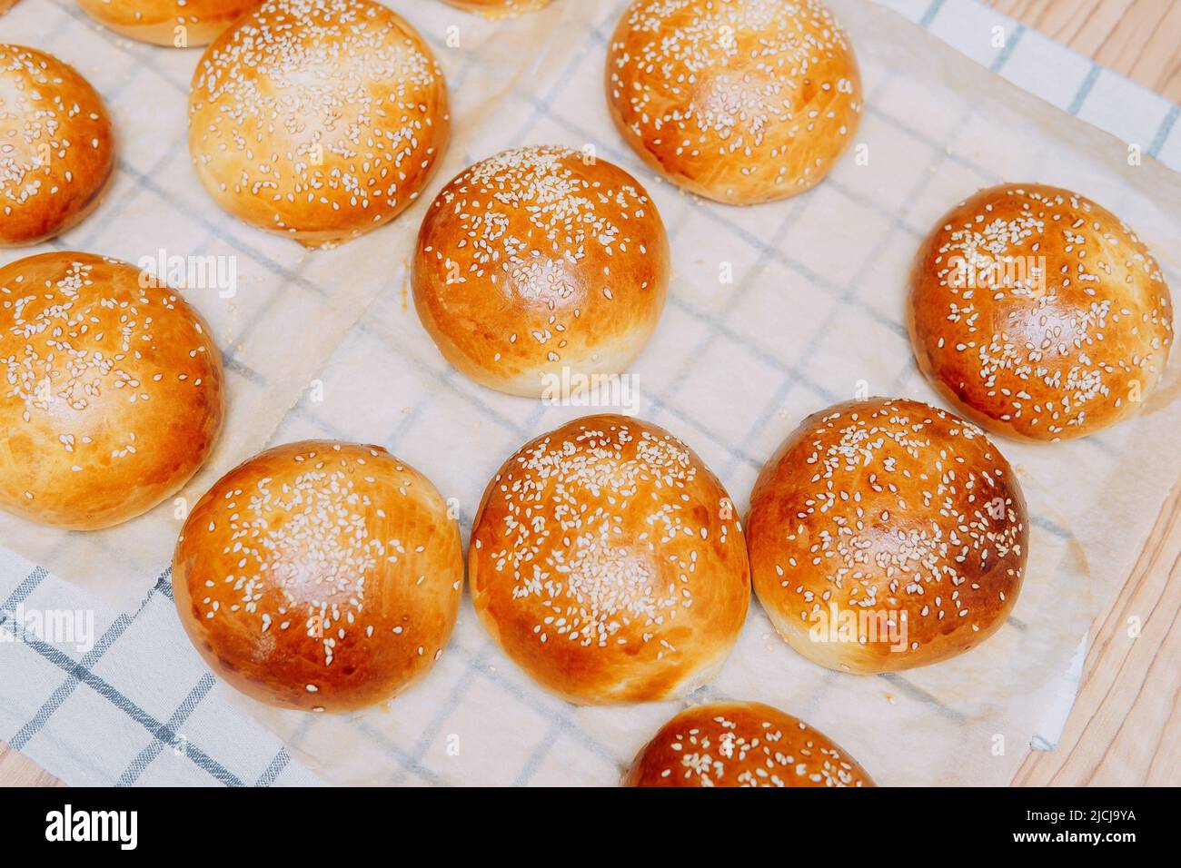 Freshly Baked Burger Buns With Sesame Seeds. We Cook At Home Stock ...