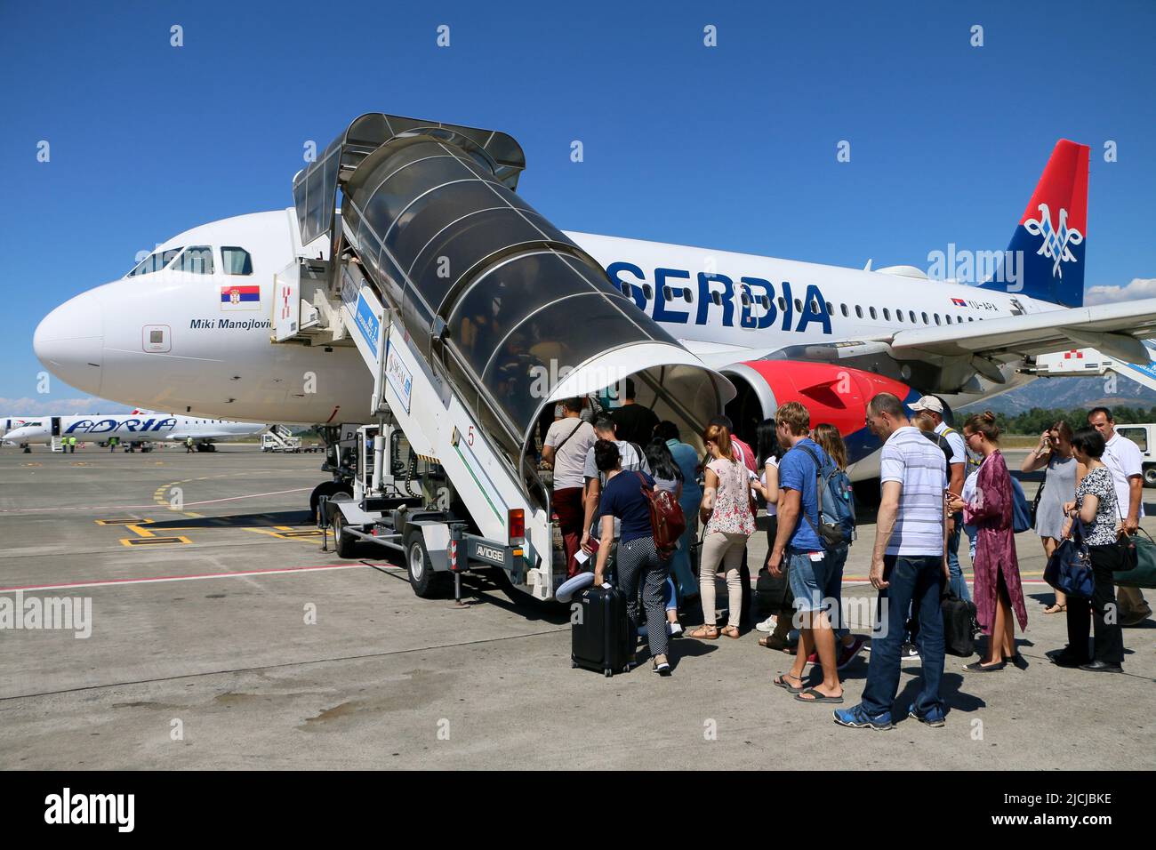 Tirana, Albania - 29.07.2017: Passengers are boarding Air Serbia plane Tirana International Airport Nene Tereza, also known as the Rinas International Stock Photo