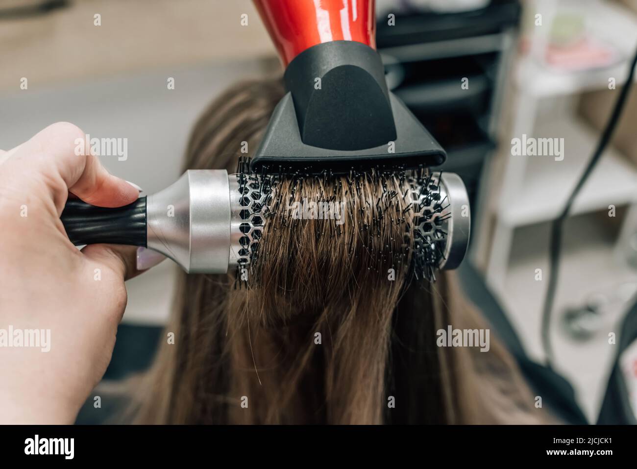 Hair blonde dryer round brush hi-res stock photography and images - Alamy