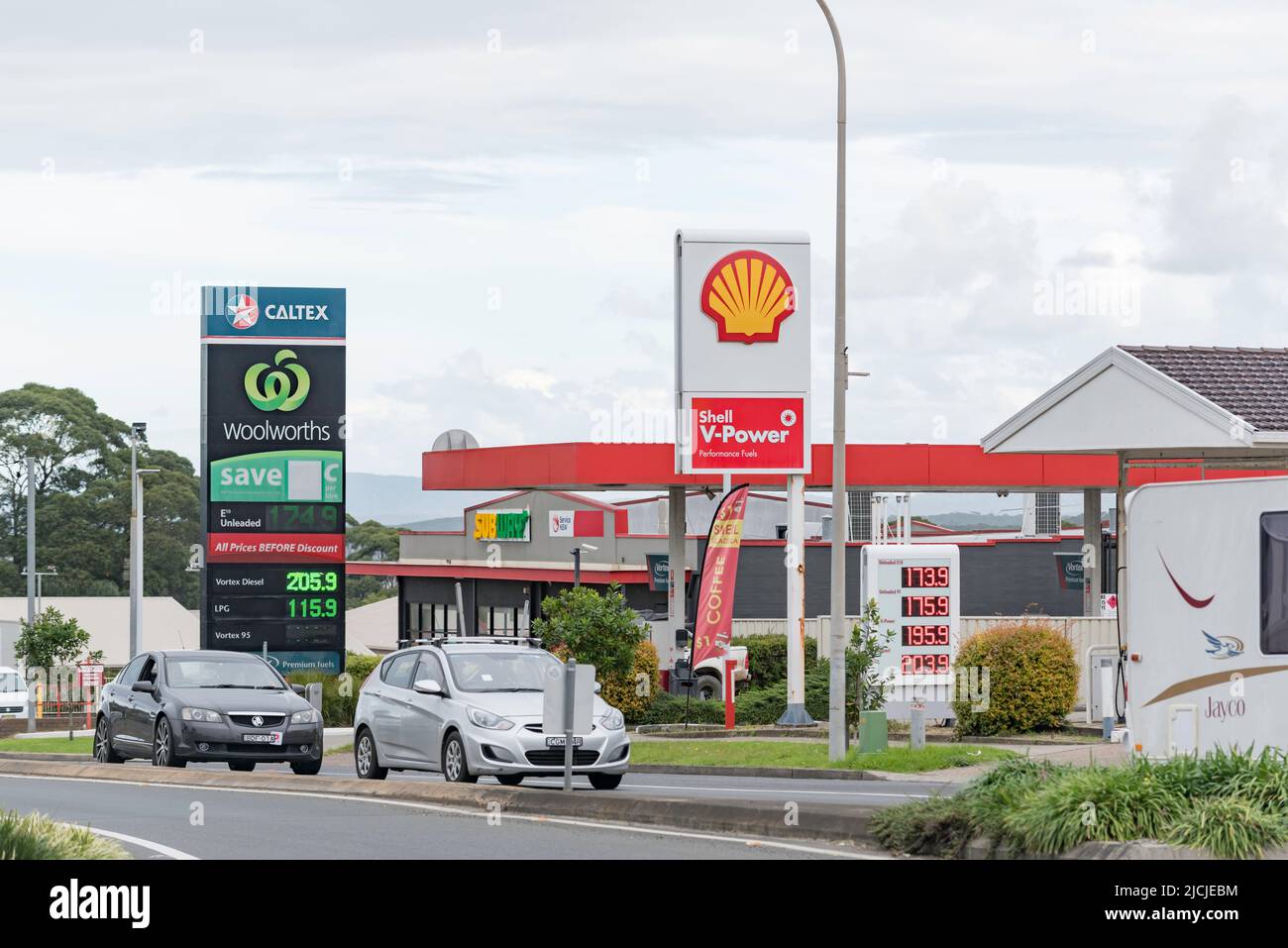 Two petrol service stations, a Shell and a Woolworths Caltex, situated next door to each other