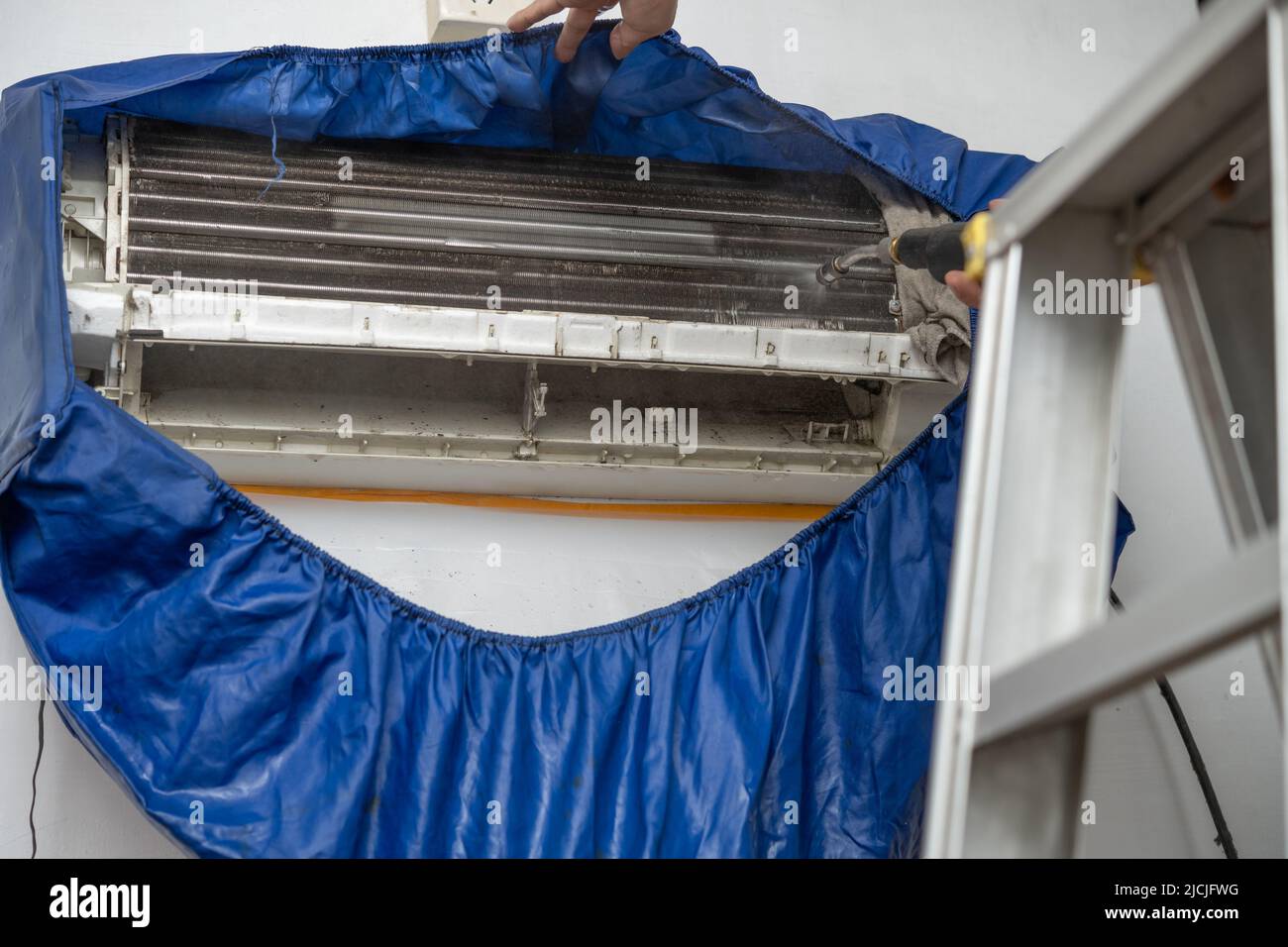 cleaning the air conditioner with chemical liquid Stock Photo Alamy