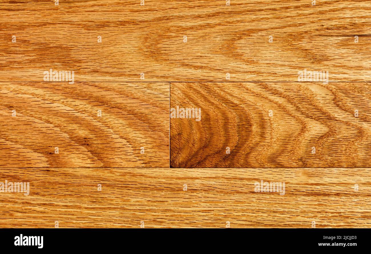Top view of oak wood boards with natural pattern and red color background Stock Photo