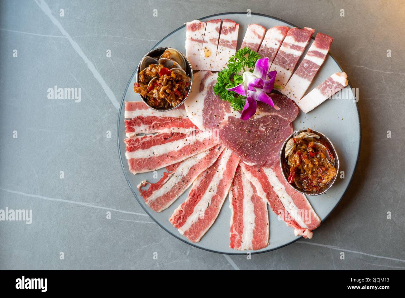 Chinese barbecue raw pork meat plate top view Stock Photo