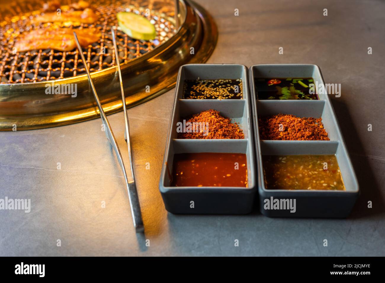 Chinese spicy sauces for barbecue grill on a grey table Stock Photo