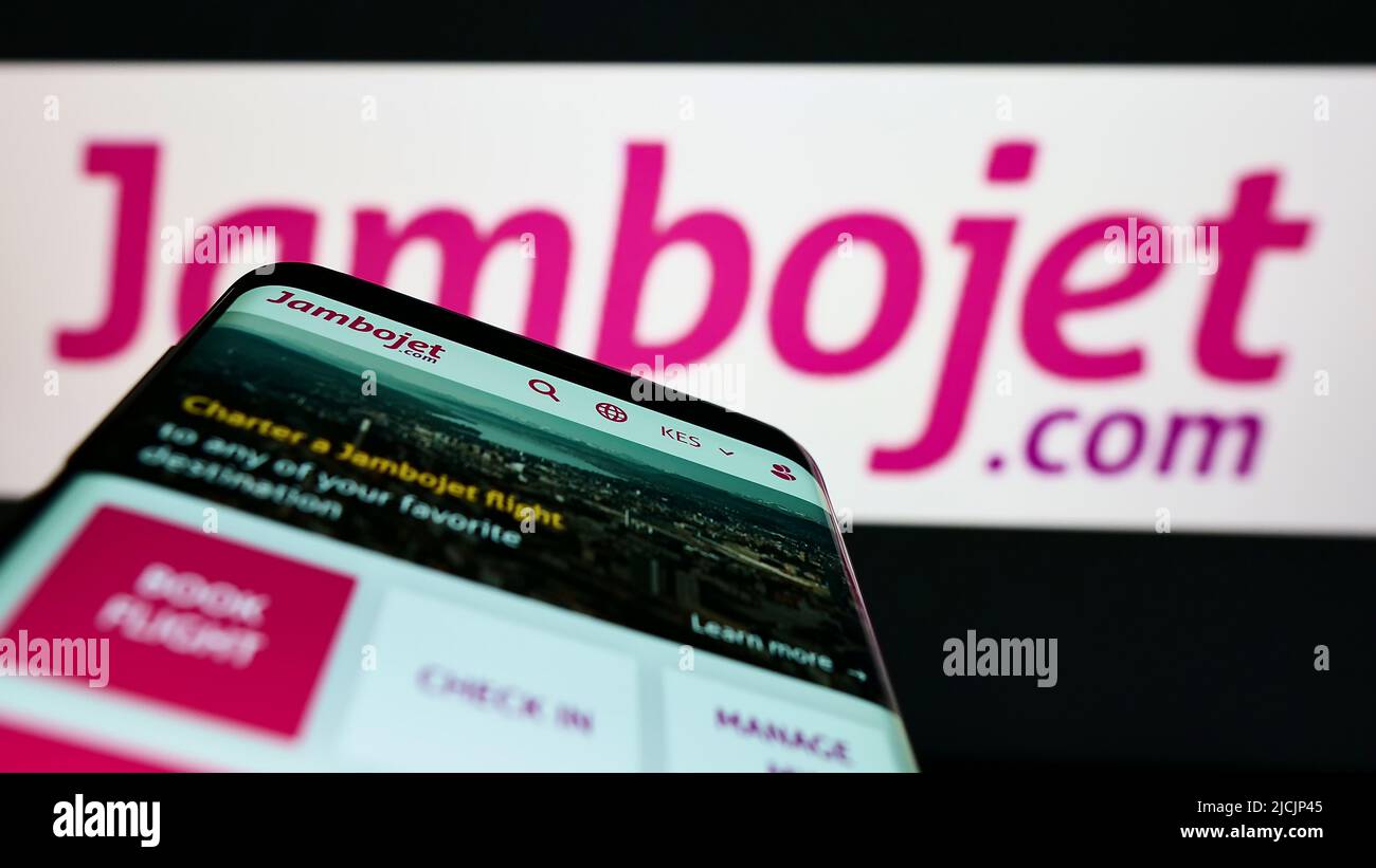 Mobile phone with webpage of Kenyan airline company Jambojet Limited on ...