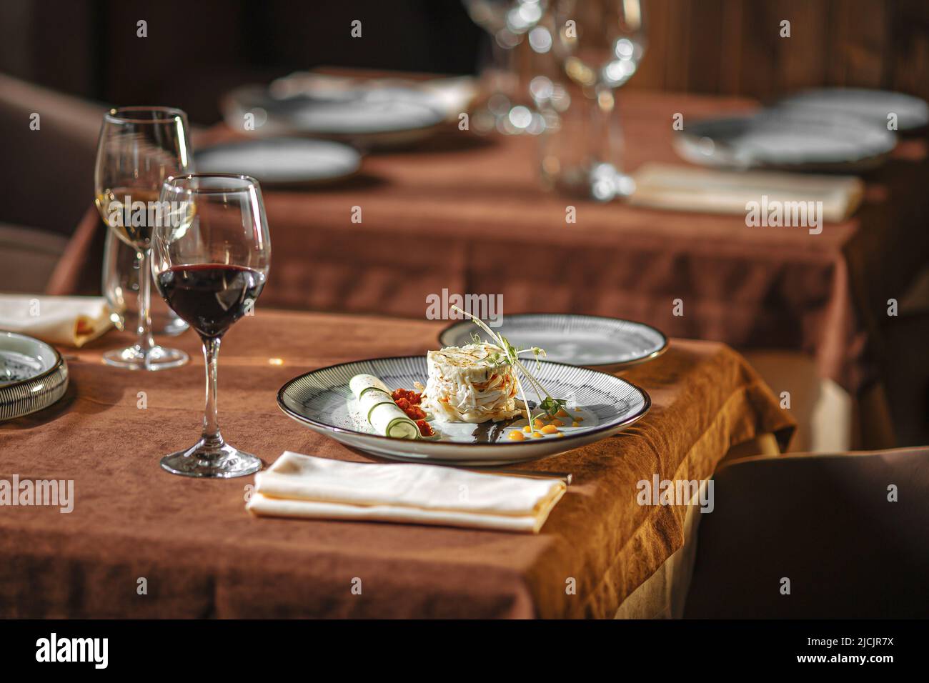 Served restaurant table with drinks and food Stock Photo