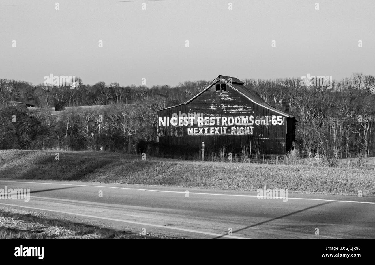 Painted barn restroom advertisement on interstate 65 Stock Photo