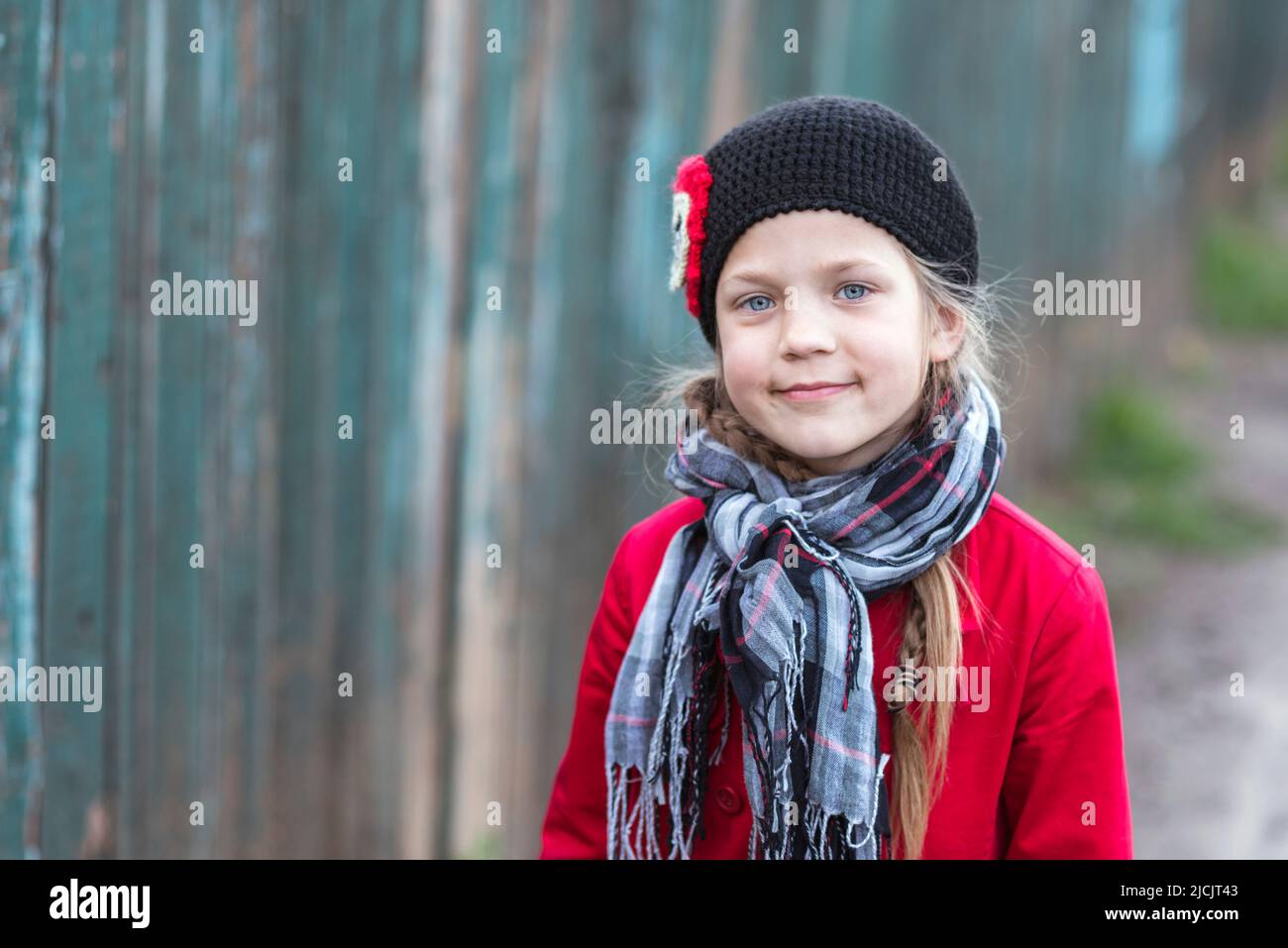 cheerful child girl in fashion clothes by springtime Stock Photo