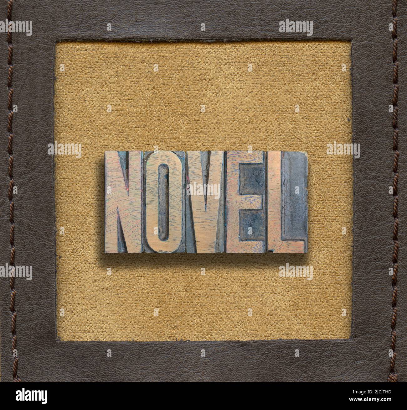 novel word assembled from vintage wooden letterpress inside stitched leather frame Stock Photo