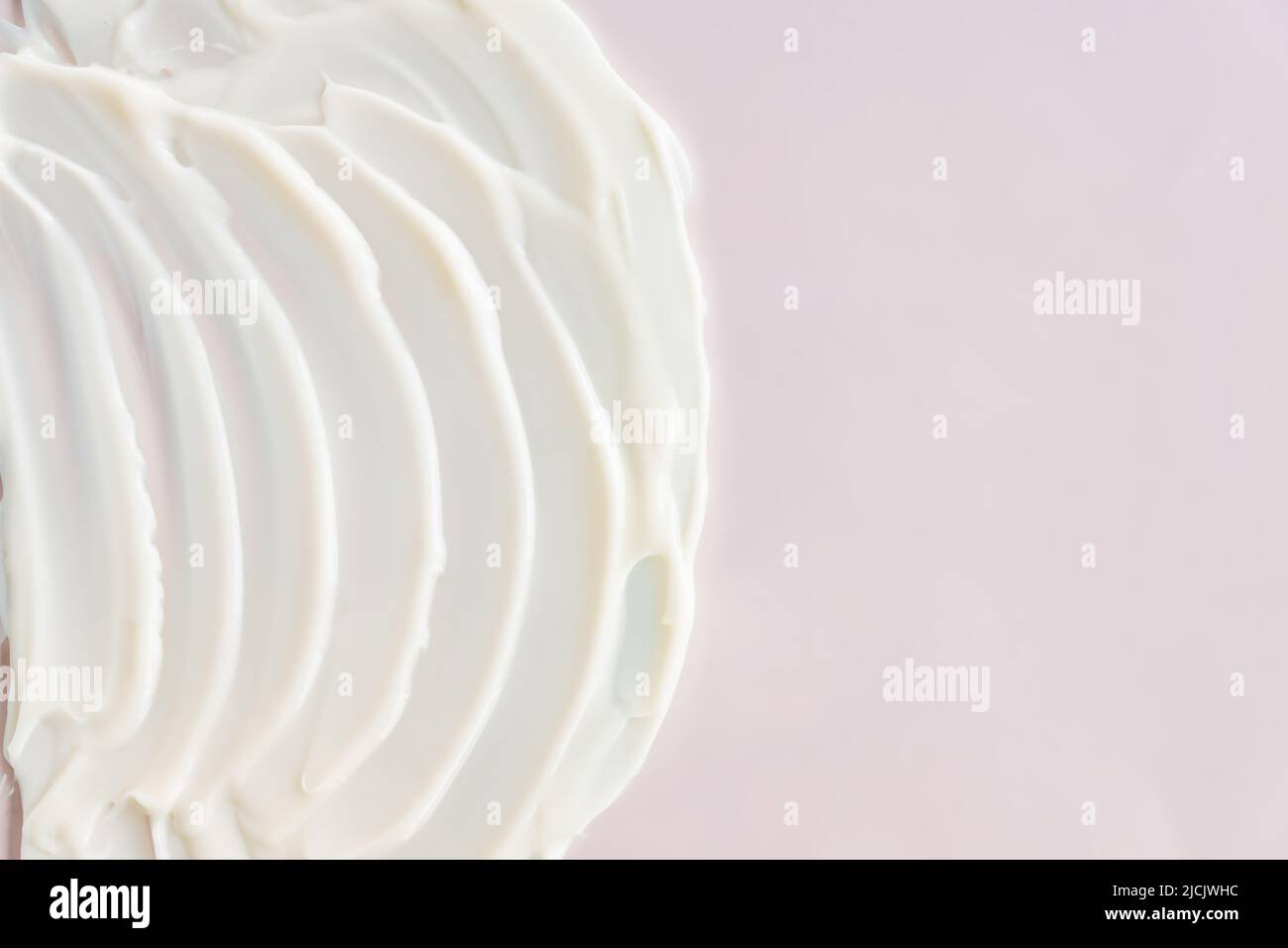 Cosmetic product cream gel texture smudge on pastel beige background Stock Photo Alamy