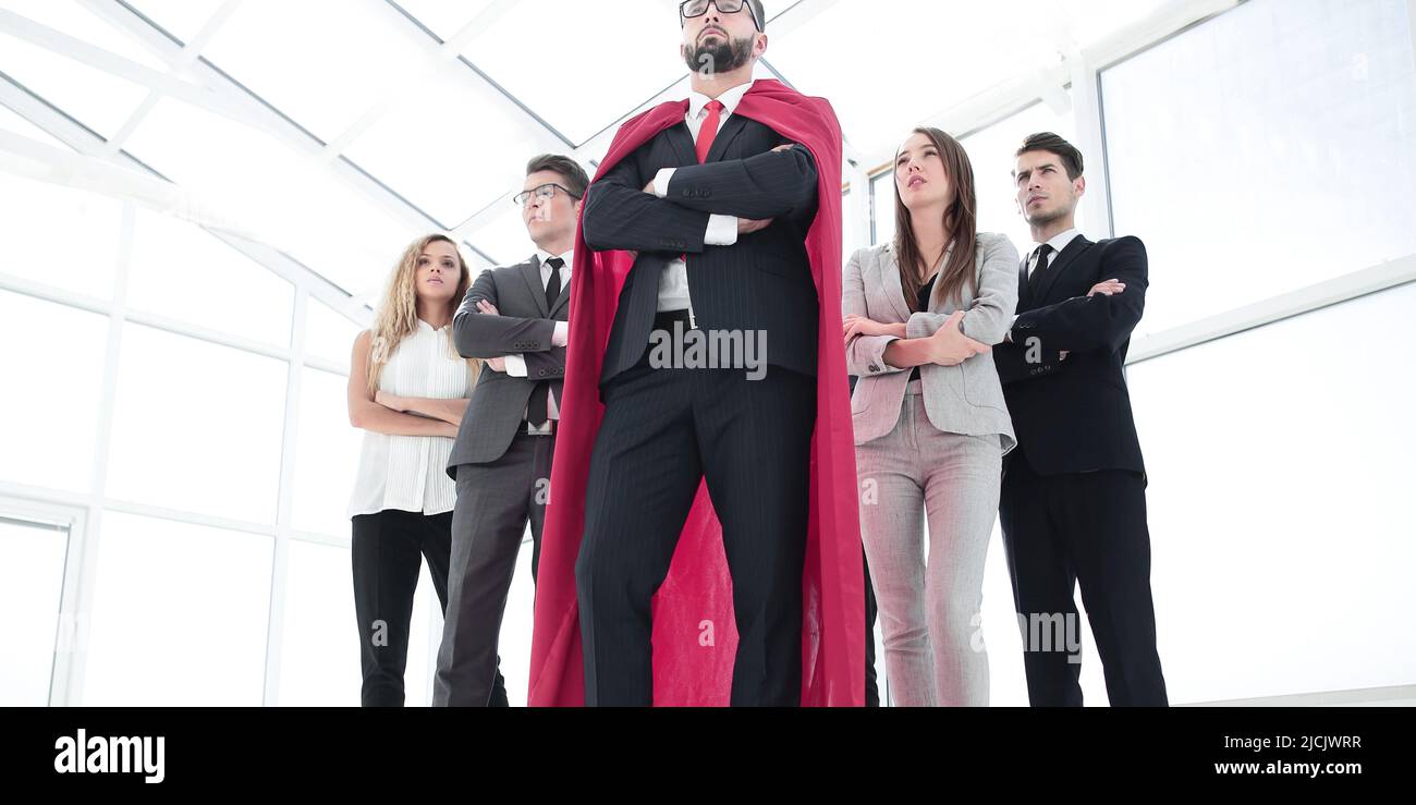 leader in the red cloak and the business team standing together Stock ...