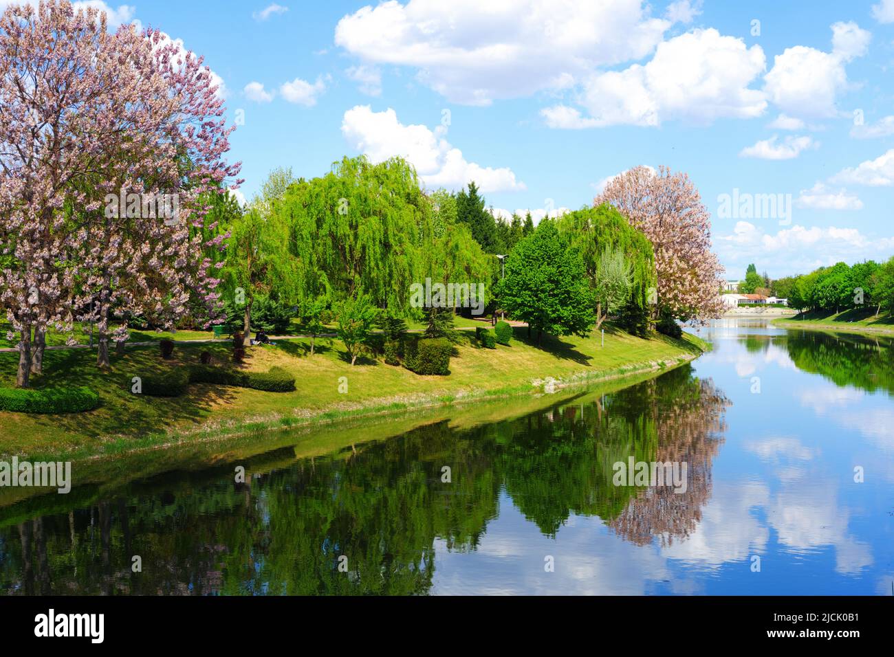 White nice clouds on blue sky with reflection on river Stock Photo