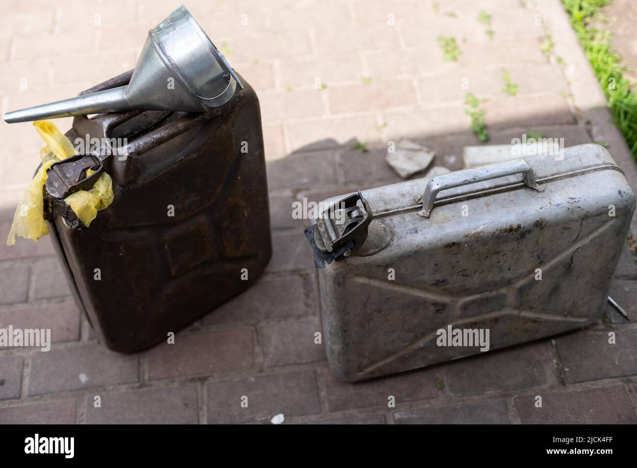 fuel canister and watering can Stock Photo Alamy