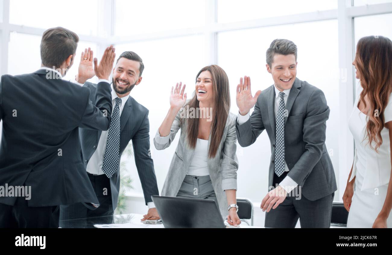 happy business team standing near office Desk Stock Photo - Alamy