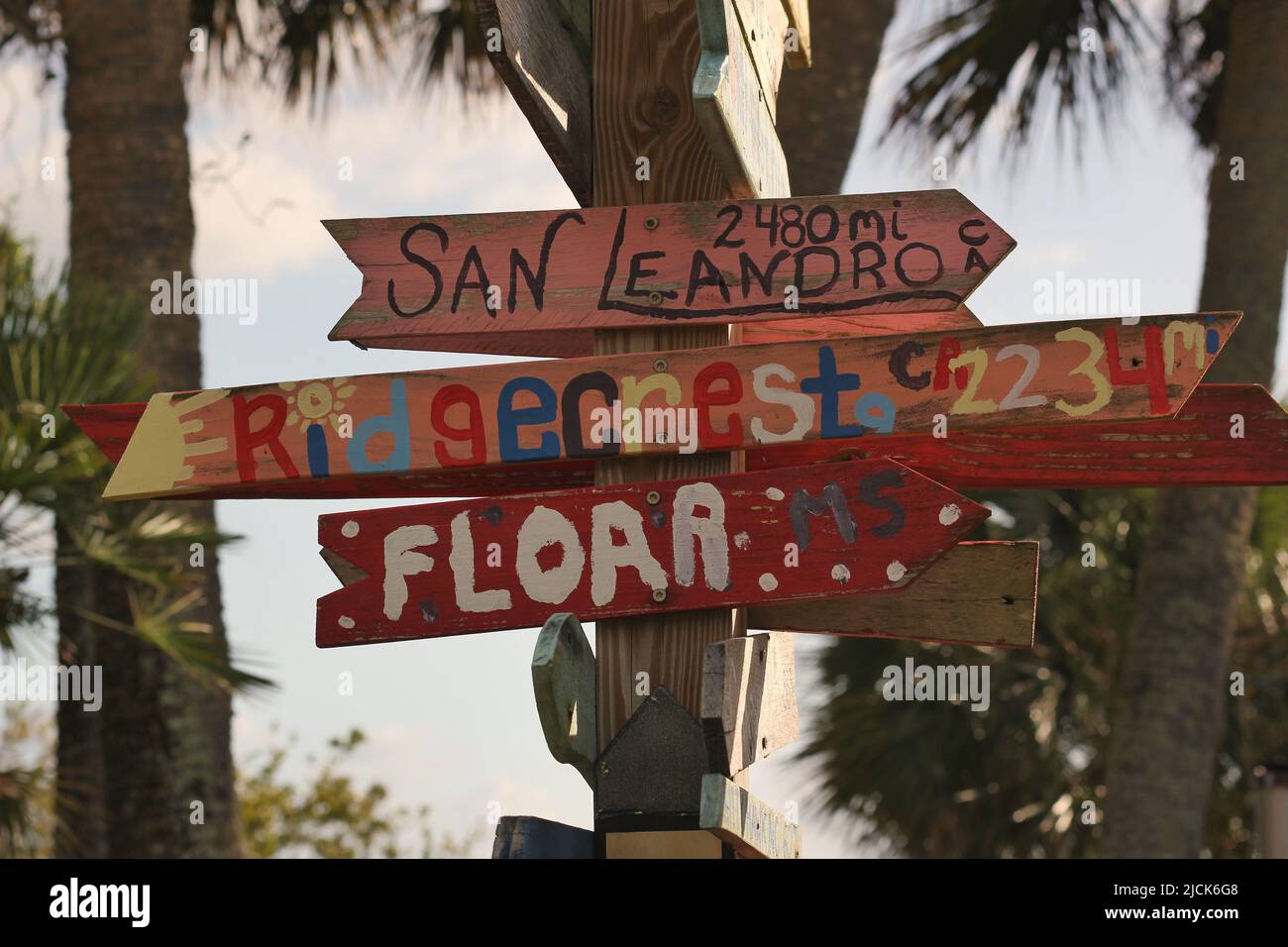 Hand painted wooden signs showing the distance to San Leandro, California. Stock Photo