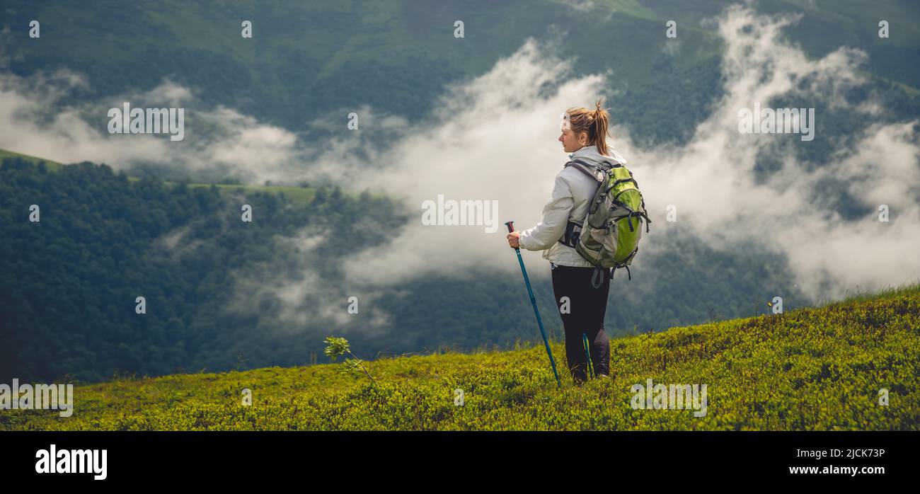 Young woman hiking in the mountains Stock Photo - Alamy