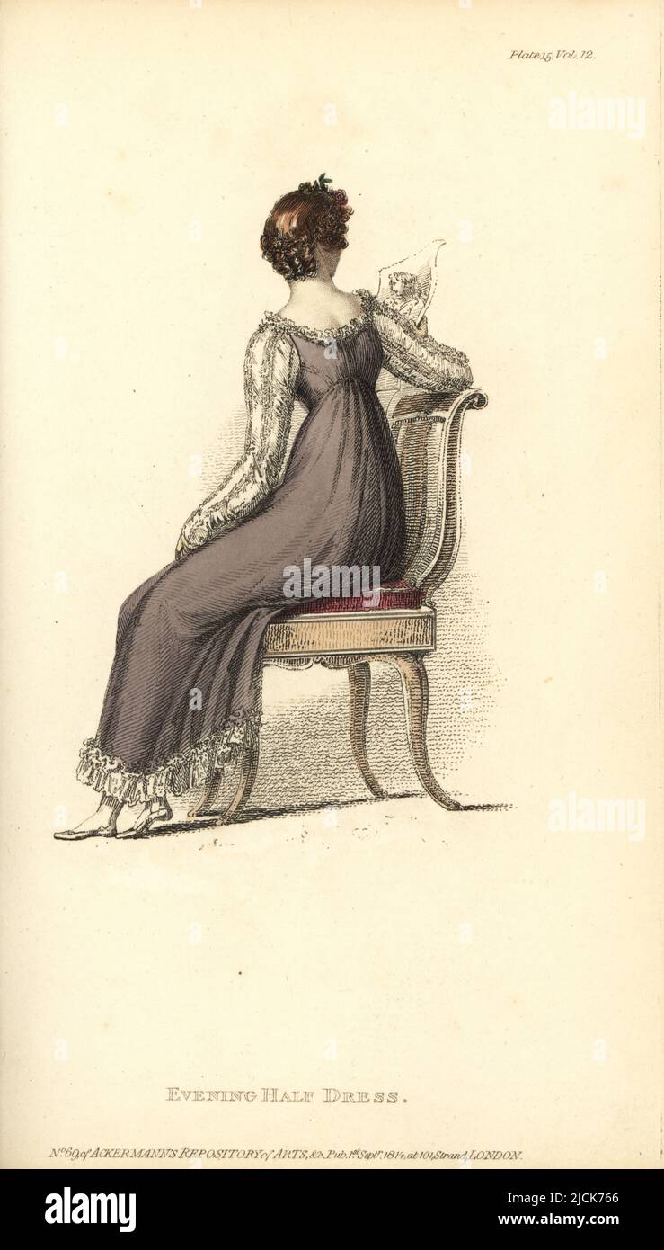 Regency woman looking at an engraving, seated on a chair. Evening half-dress: plain frock with striped sarsnet Italian net back, blond lace quilling, white satin sleeves, hair in short full curls behind. Vol. 12, Plate 15, September 1, 1814. Handcoloured copperplate engraving by Thomas Uwins from Rudolph Ackermann's Repository of Arts, Strand, London. Stock Photo