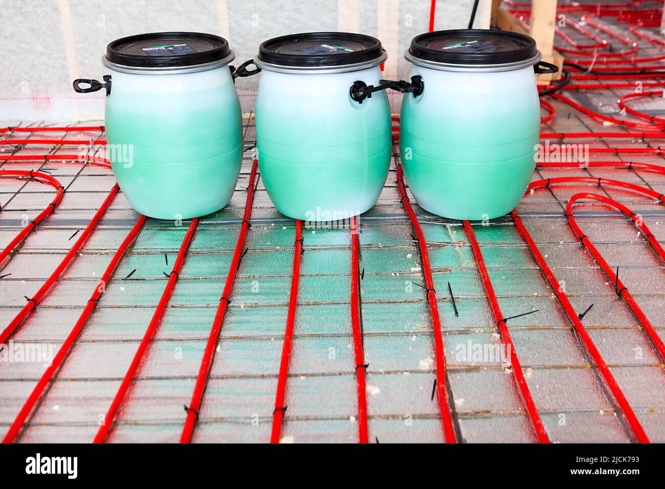 Plastic barrels of heat transfer agent for water heated floors, nobody Stock Photo