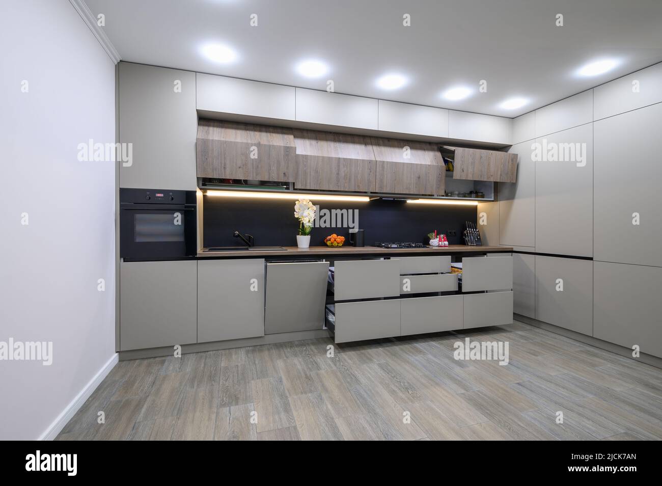 Trendy grey modern kitchen interior with minimalistic furniture Stock ...