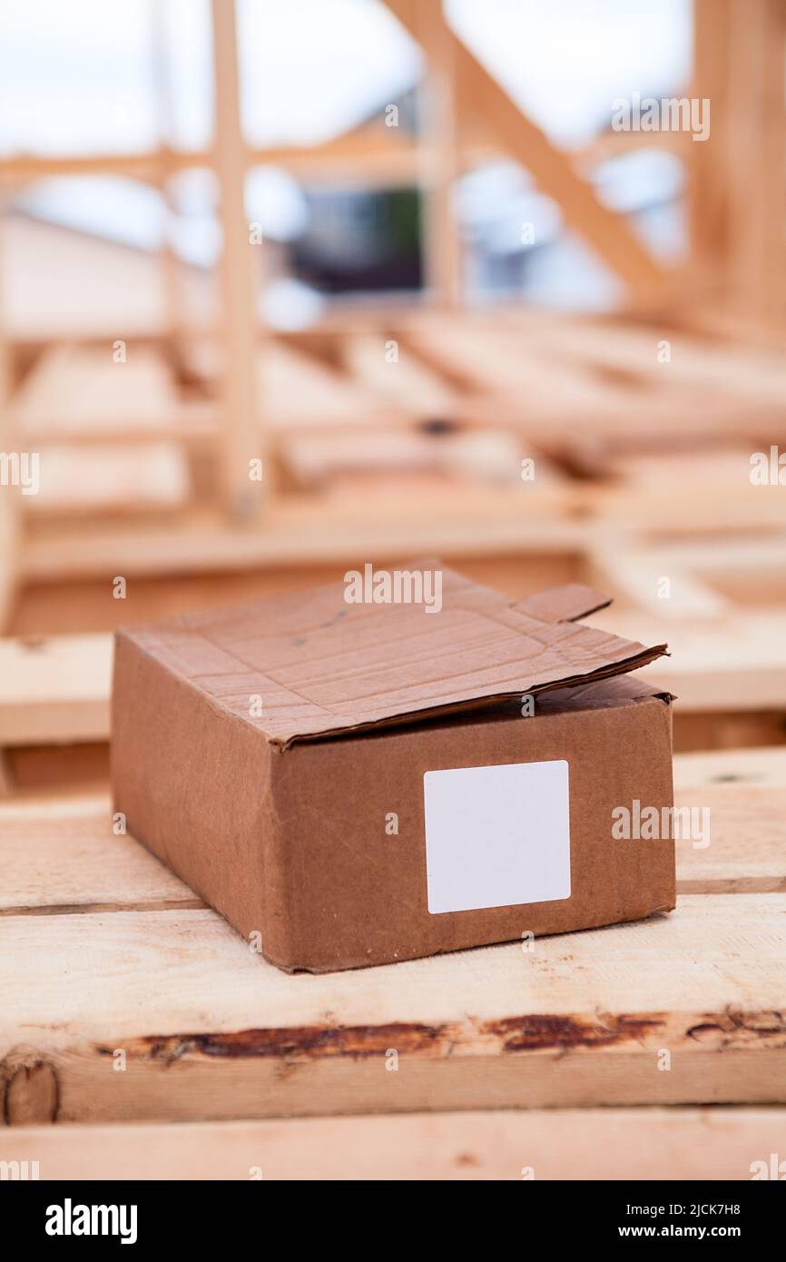Cardboard box with construction nails or self-tapping screws, blank and white marking sticker Stock Photo