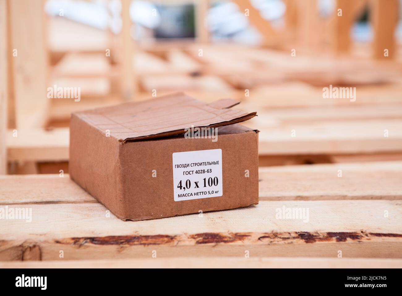 Box of construction nails, 5 kg marking sticker, Russian Stock Photo