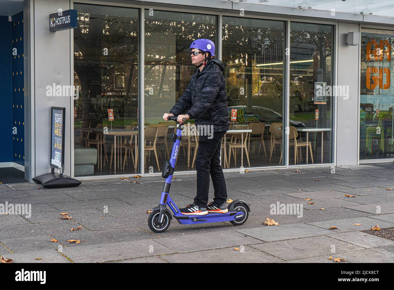 Beam scooters with helmet hires stock photography and images Alamy
