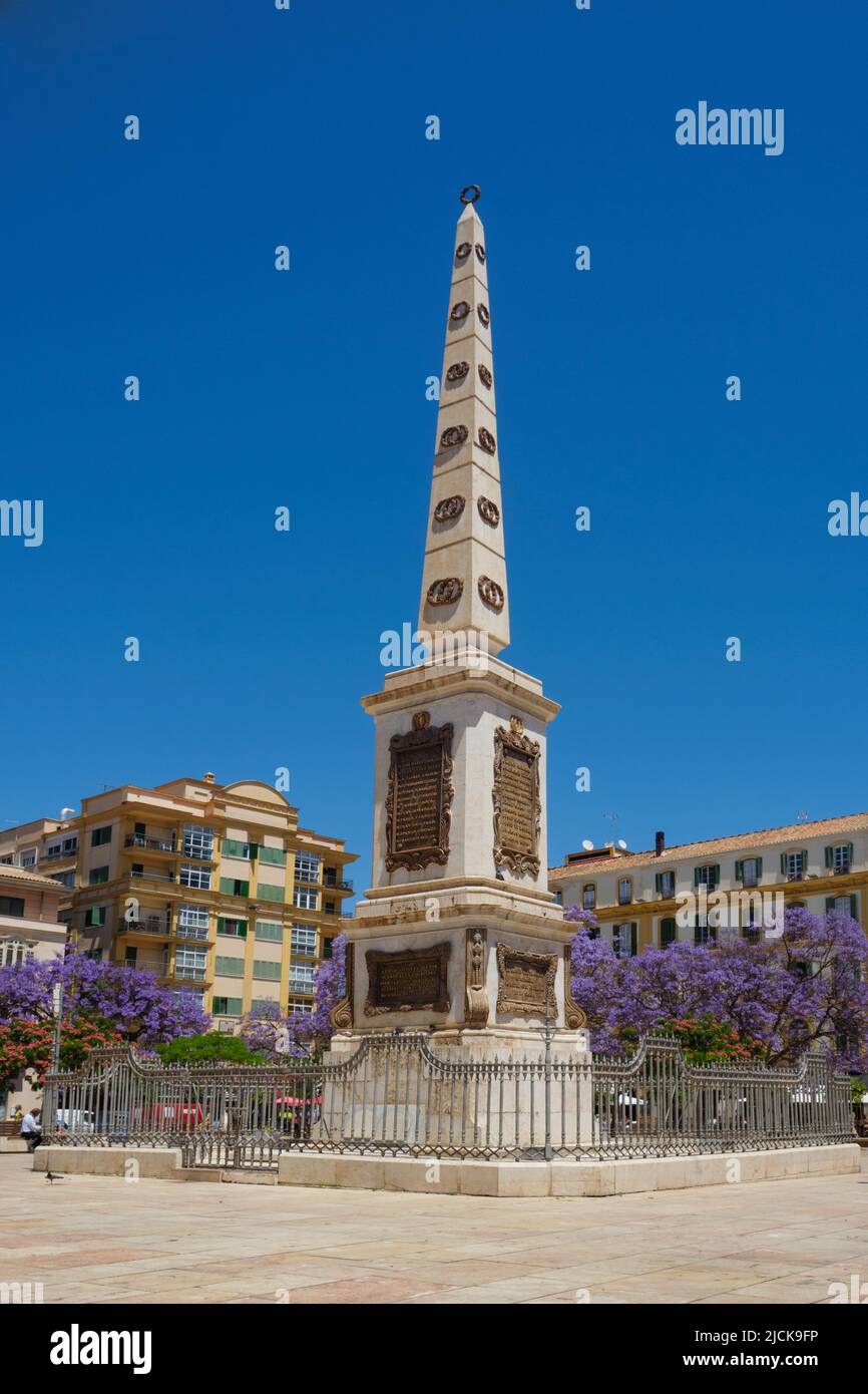 Malaga, Spain - May 26, 2022: La Merced square in Malaga, Spain, presided by an obelisk in honor of General Torrijos, is one of the main squares in th Stock Photo