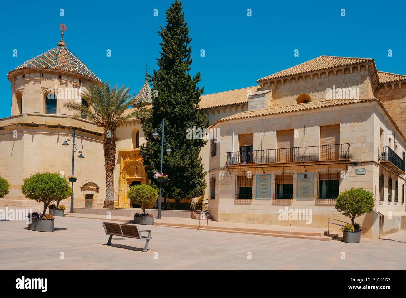 Lucena, Spain - May 27, 2022: A side view of the Parroquia de San Mateo church in Lucena, Spain, and its secondary portal, leading to the Plaza de San Stock Photo