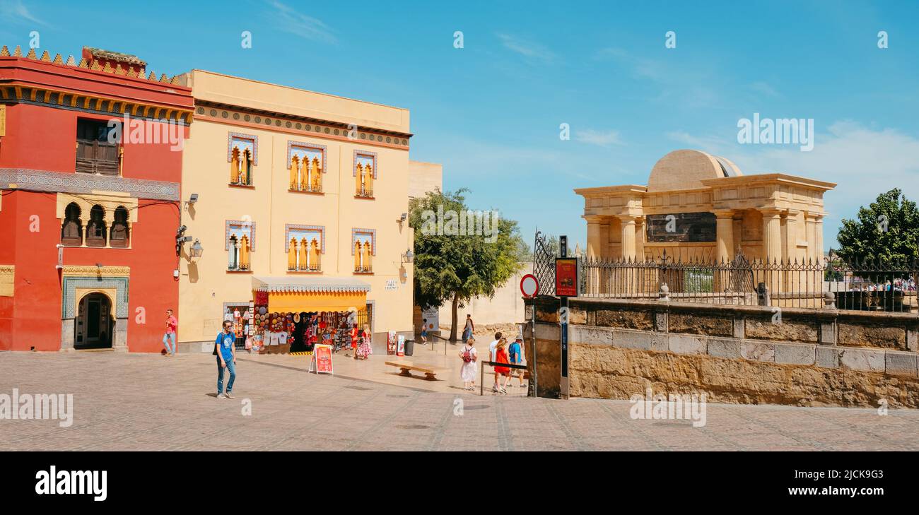 Cordoba, Spain - May 29, 2022: A view over the Plaza del Triunfo square in Cordoba, Spain, highlighting the Puerta del Puente gate on the right Stock Photo
