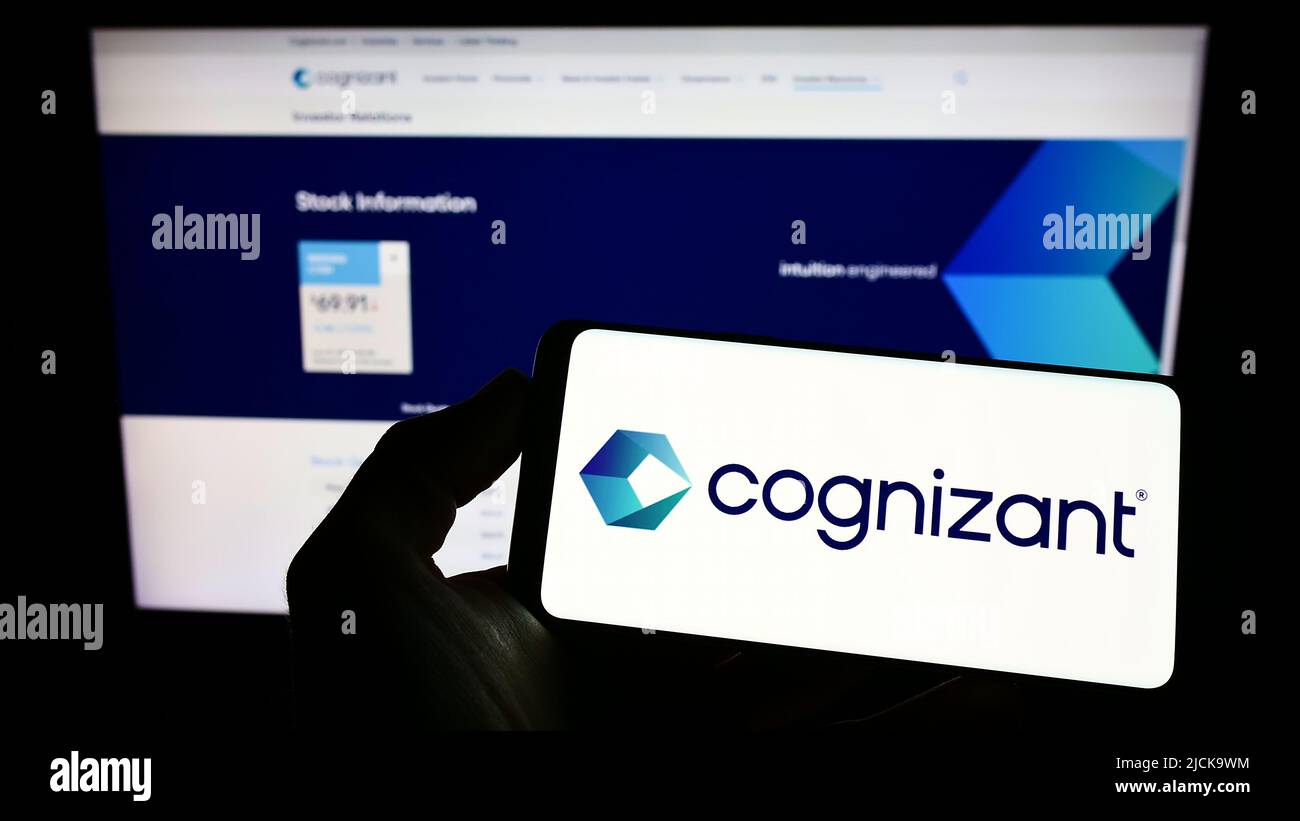 Person holding smartphone with logo of Cognizant Technology Solutions  Corporation on screen in front of website. Focus on phone display Stock  Photo - Alamy