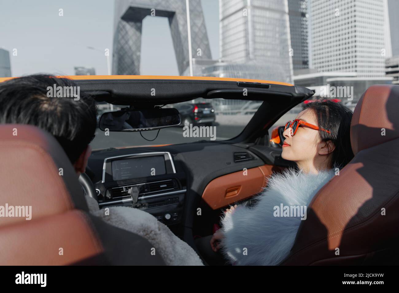 Fashionable young couples driving car for a ride Stock Photo - Alamy