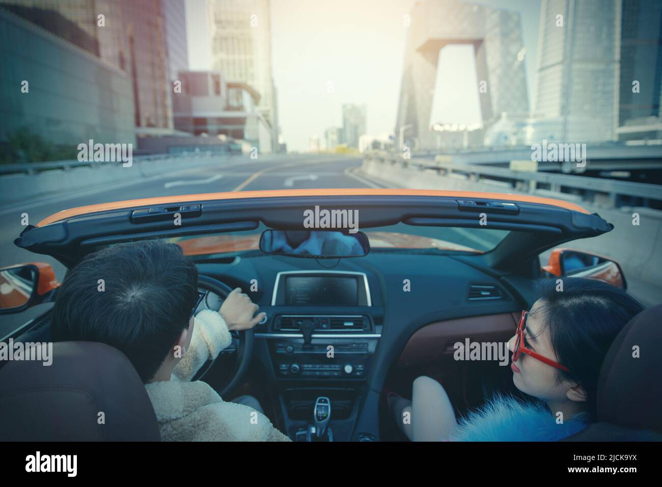 Fashionable young couples driving car for a ride Stock Photo - Alamy