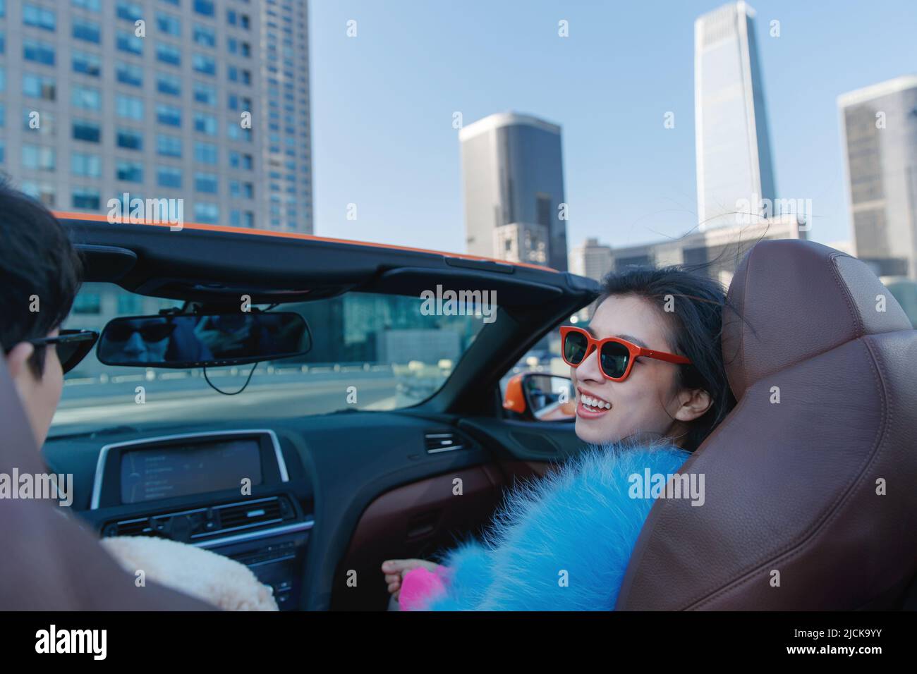Fashionable young couples driving car for a ride Stock Photo - Alamy