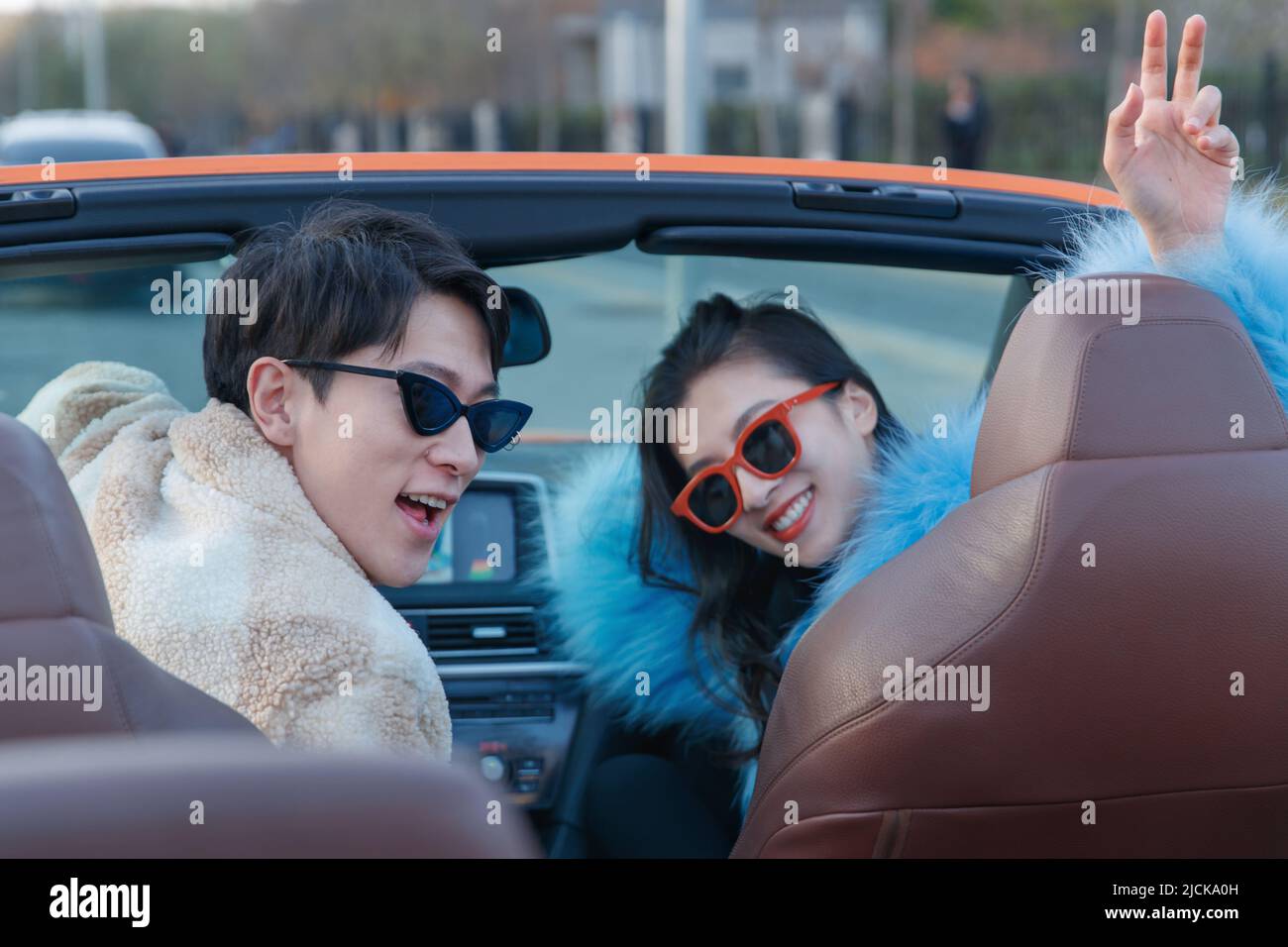 Fashionable young couples driving car for a ride Stock Photo - Alamy
