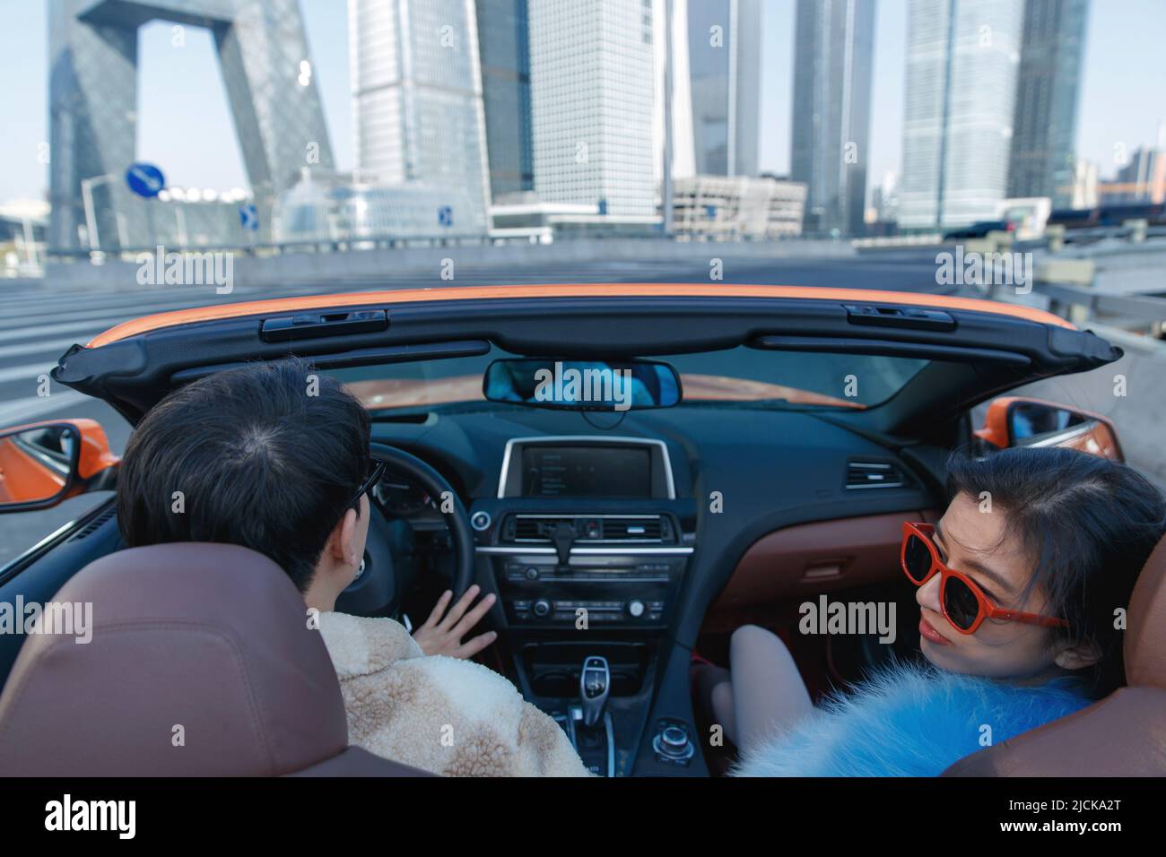 Fashionable young couples driving car for a ride Stock Photo - Alamy