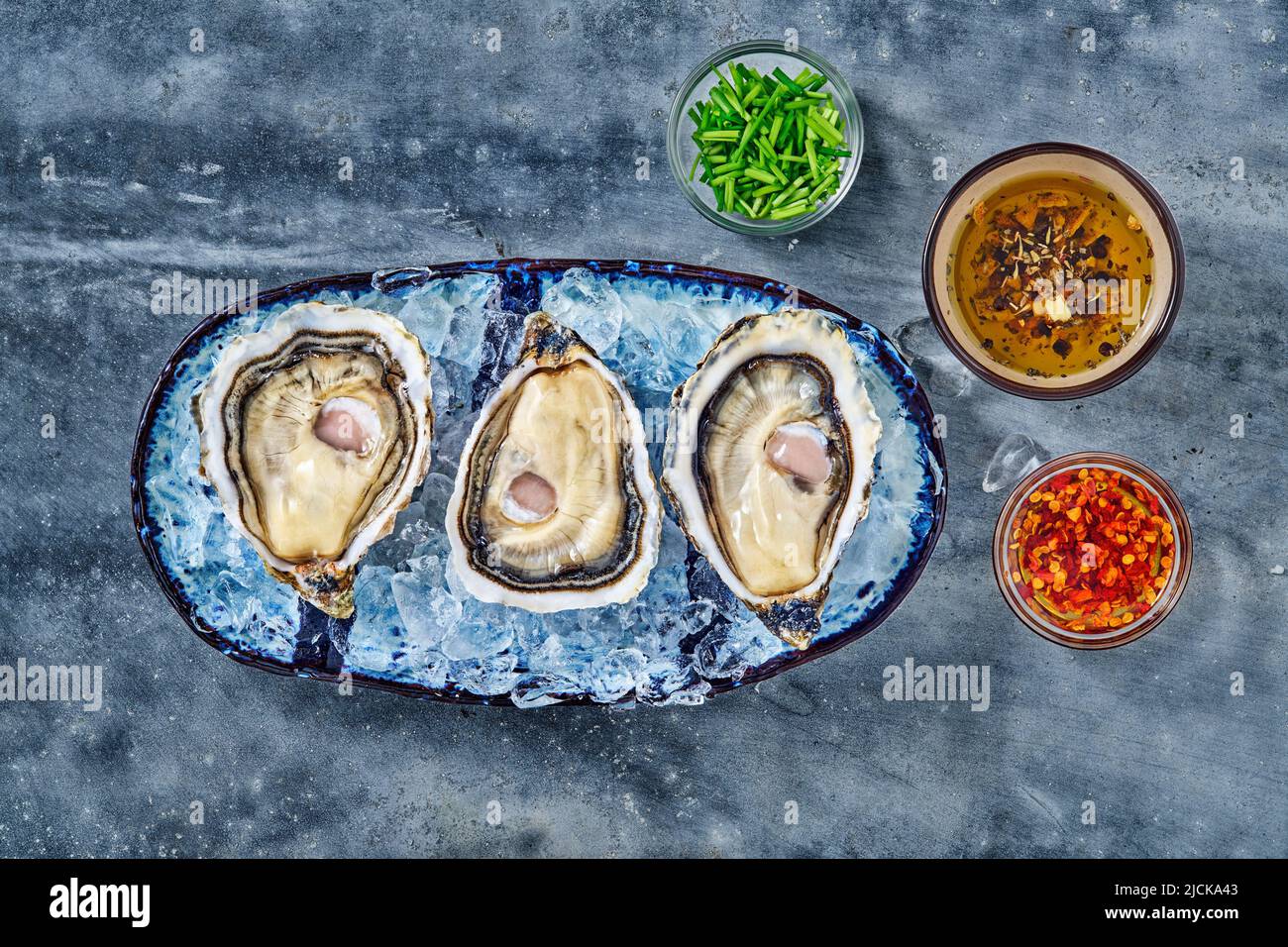 Open fresh raw oyster clams isolated and ready to eat Stock Photo Alamy