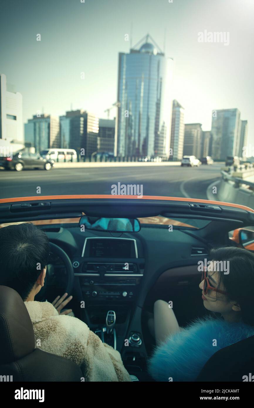 Fashionable young couples driving car for a ride Stock Photo - Alamy