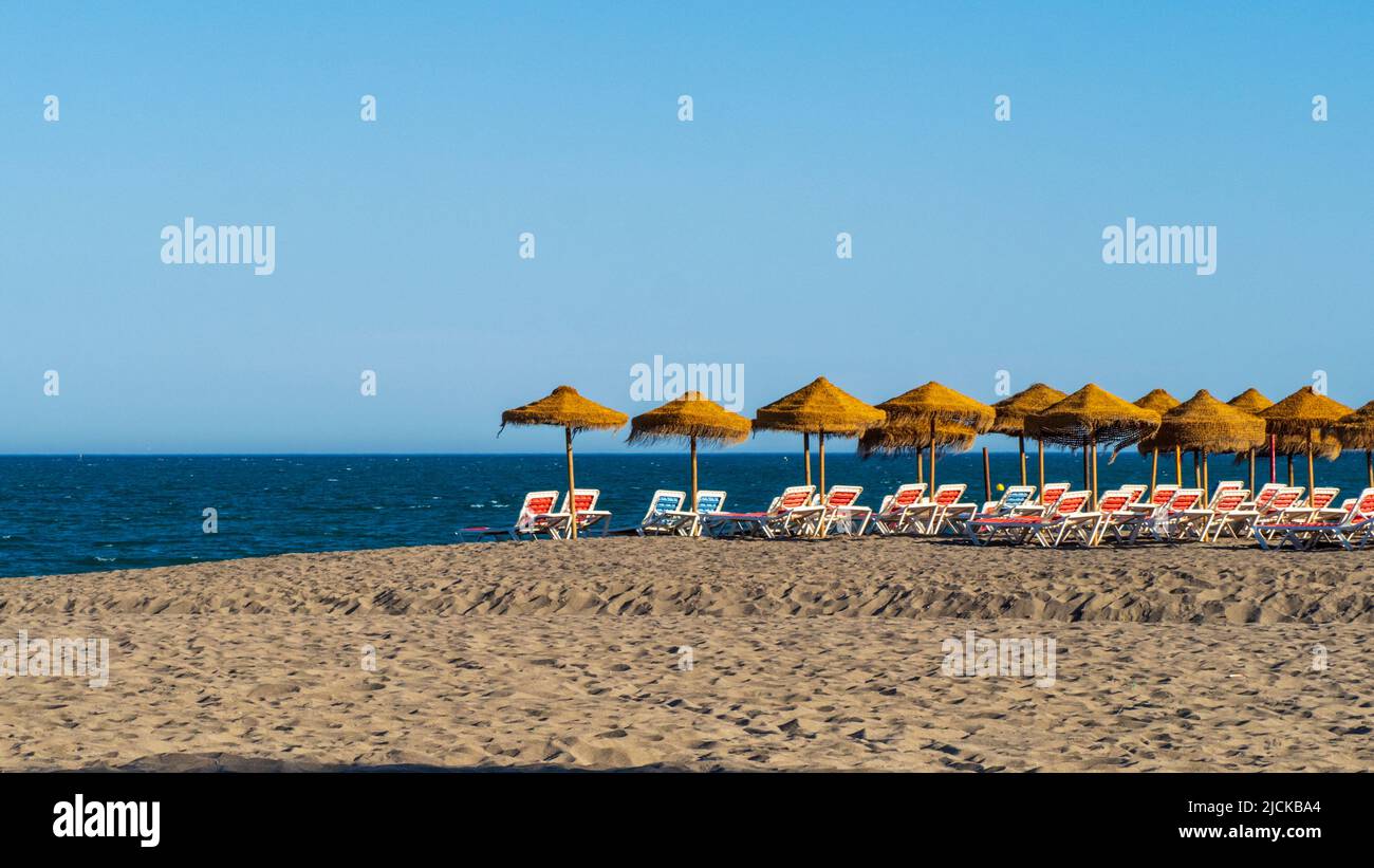 Plot of hammocks and beach umbrellas in Torremolinos Stock Photo
