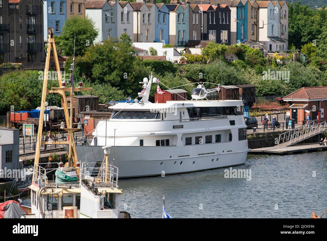 The Miss Conduct yacht moored in the harbourside area of the Bristol floating harbour on a sunny day. Stock Photo