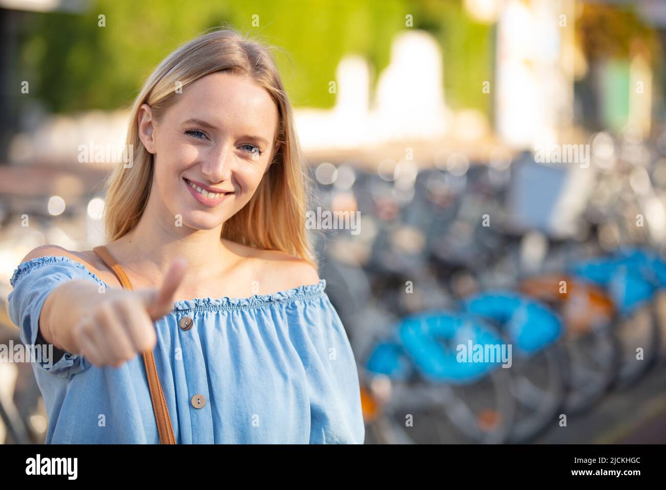 Happy tourist woman thumb hi-res stock photography and images - Alamy